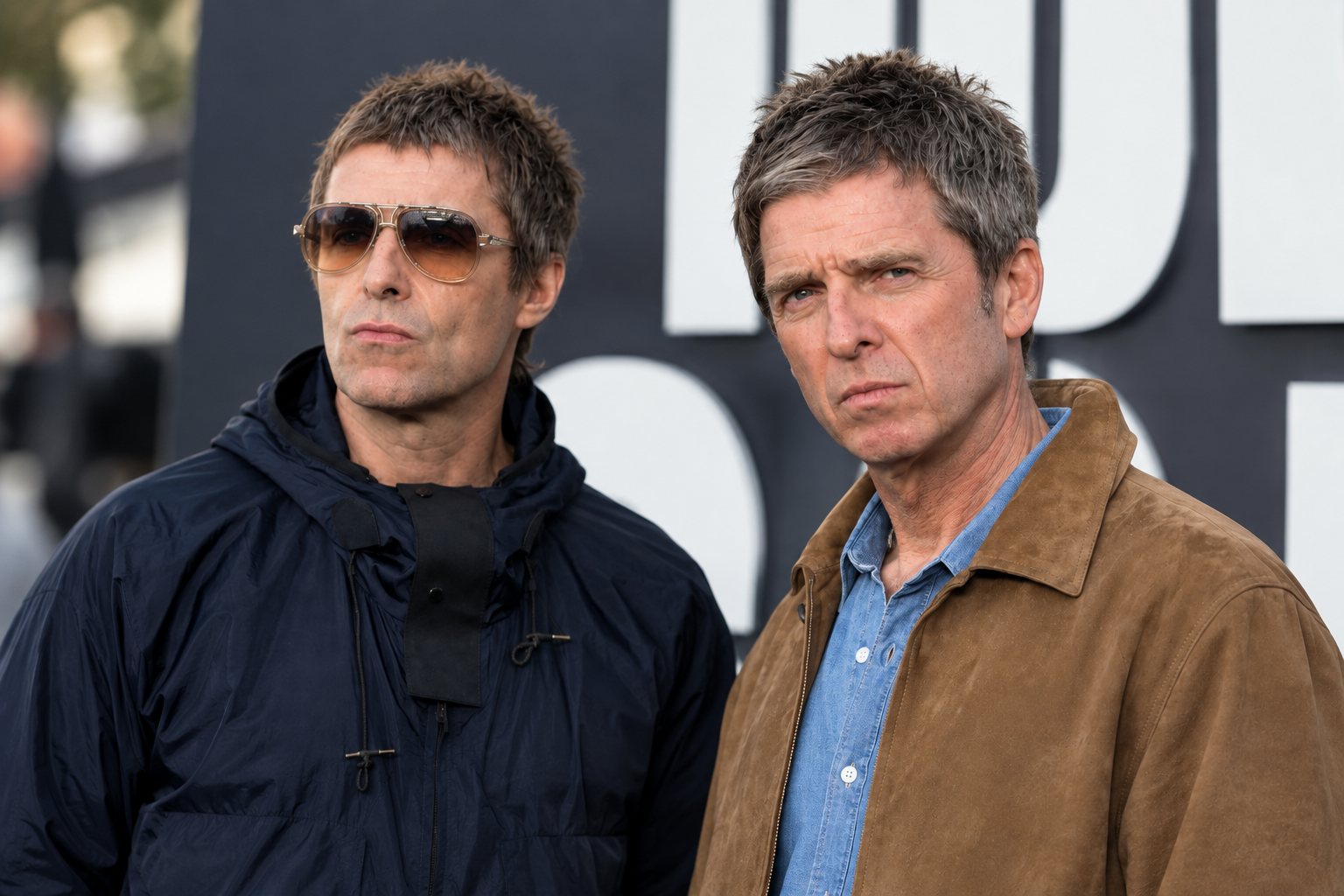 Oasis on stage with the Gallagher brothers centre stage
