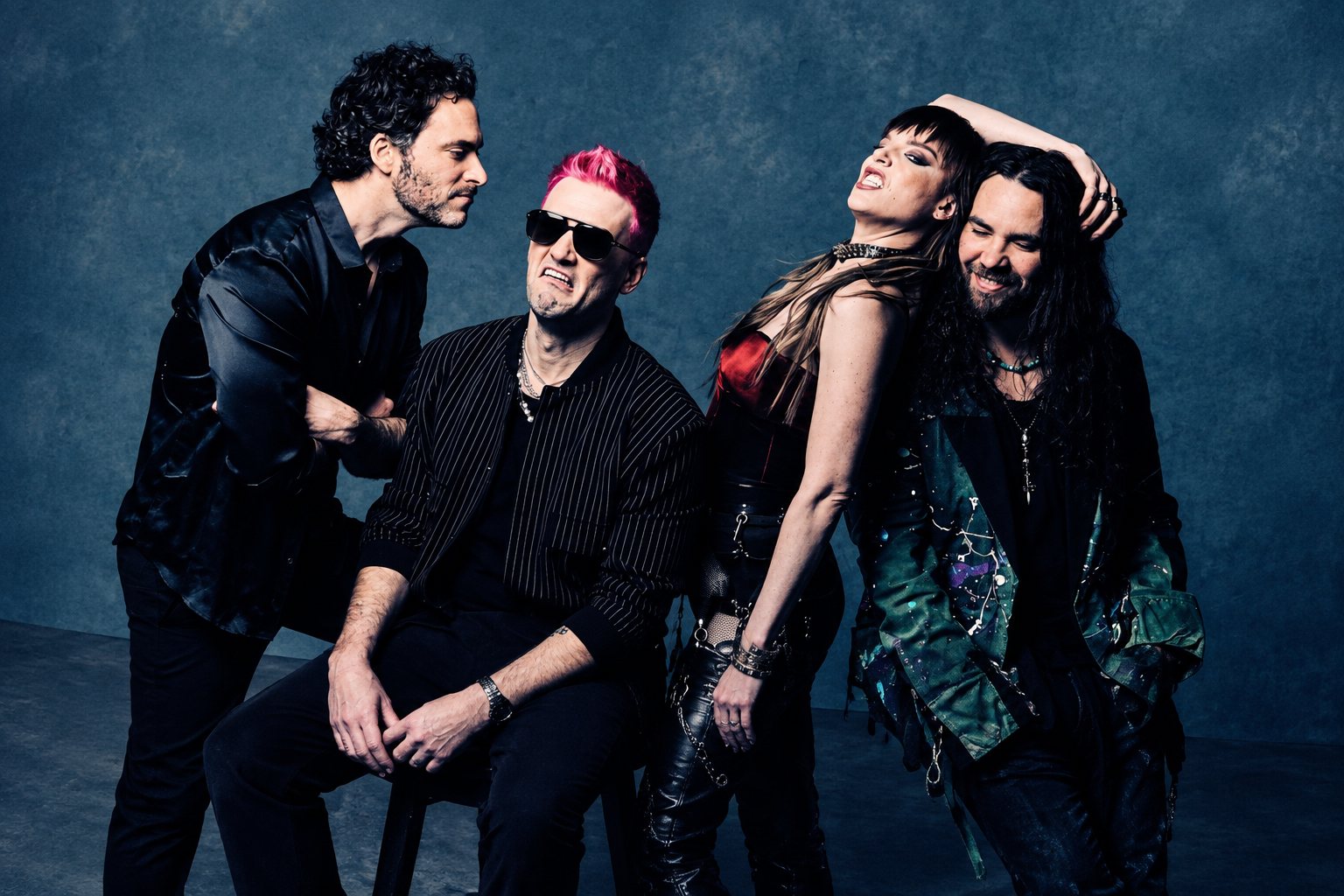 Lzzy Hale and Joe Hottinger performing acoustically on stage, close and candid