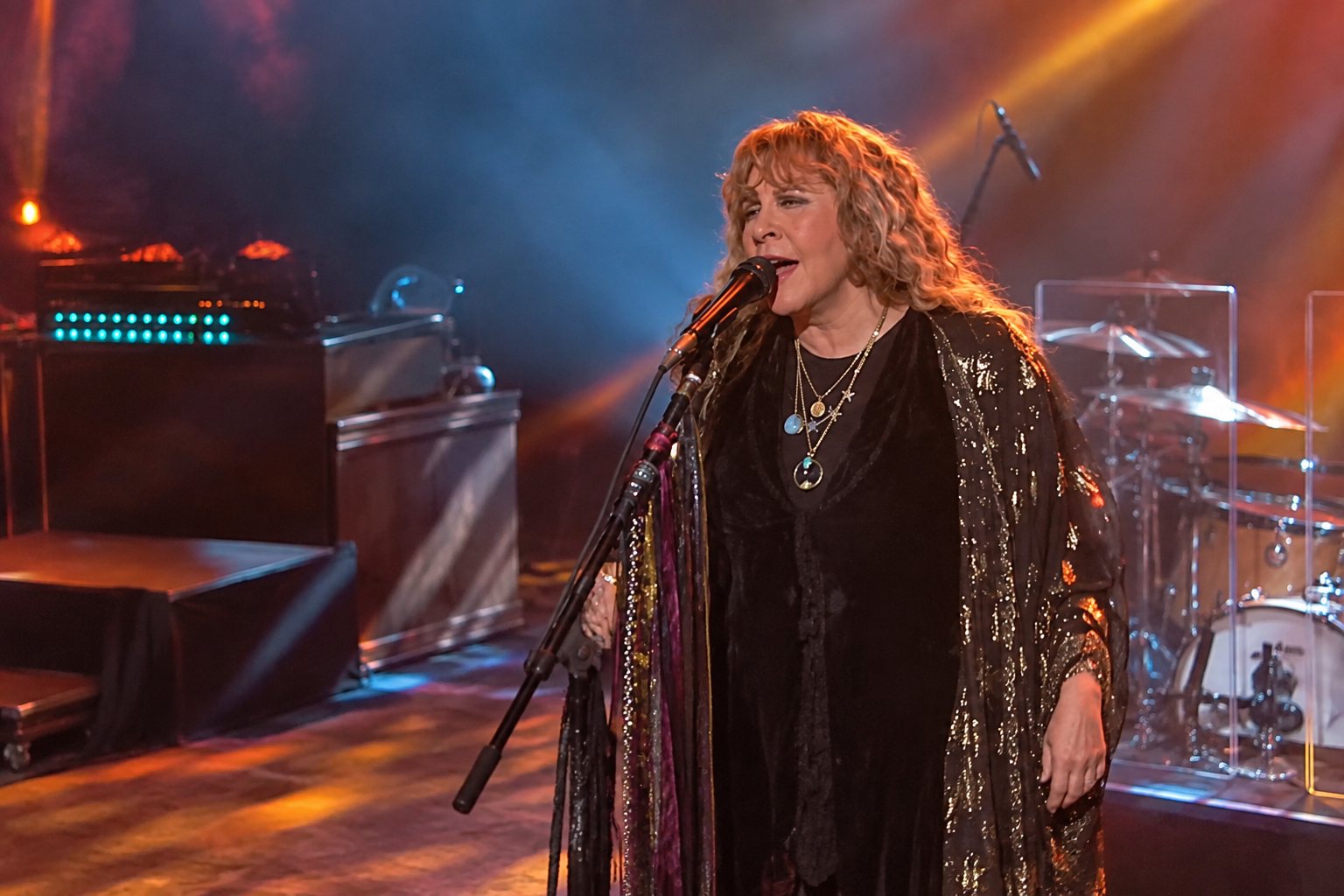 Stevie Nicks performing 'Stand Back' on Jimmy Kimmel Live with spotlight and band