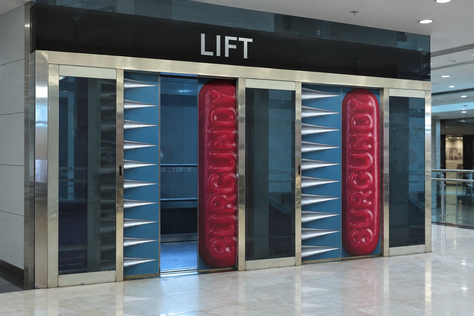 Lift doors wrapped with a giant Jelly Baby on one side and a wall of spikes on the other for Maynards Bassetts campaign